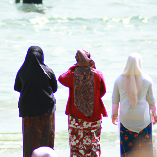 קבוצת נשים לובשות סגנונות שונים של בגדי ים צנועים בחוף הים